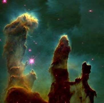 Den samme prosessen som tar livet av stjernefostrene, lager de fantastiske erosjonspilarene i den store skyen og stjernefabrikken M16-Ørnetåken (Foto: NASA/STScI).
