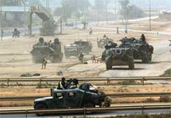 Amerikanske stridsvogner har inntatt Bagdad i dag. Foto: Reuters Goran Tomasevic 