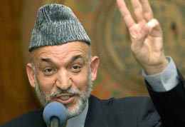 - En stor suksess for det afghanske folket, sier president Hamid Karzai om lørdagens valg. (Foto: E.Dunand, AFP)