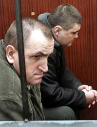 Valerij Kostenko og Mykola Protasov (t.v.)er tiltalt (Scanpix/AFP) 